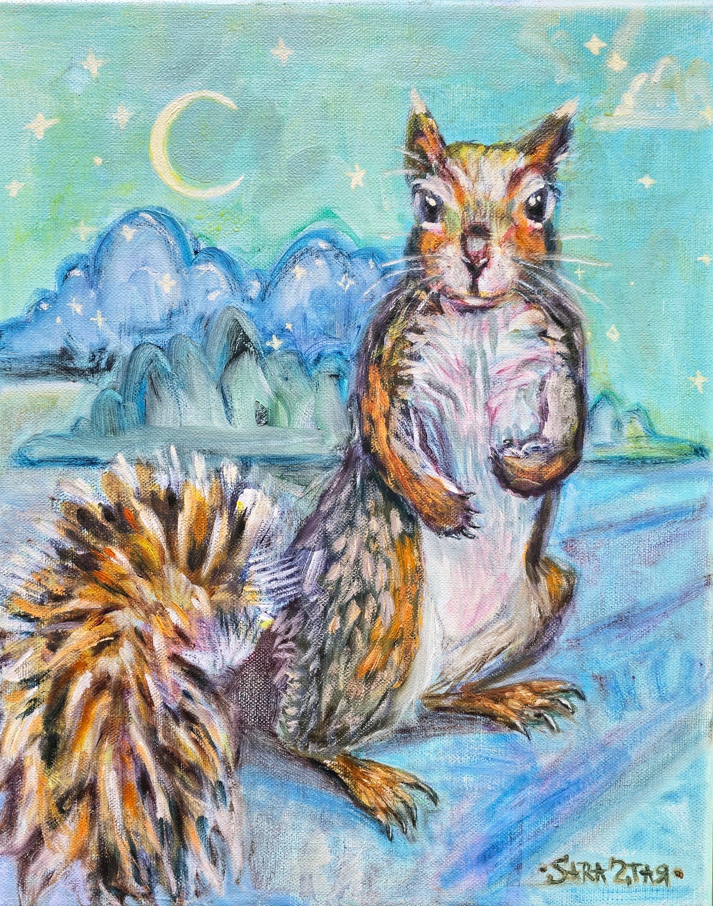 A sweet squirrel with a fluffy tall standing up and looking at the viewer