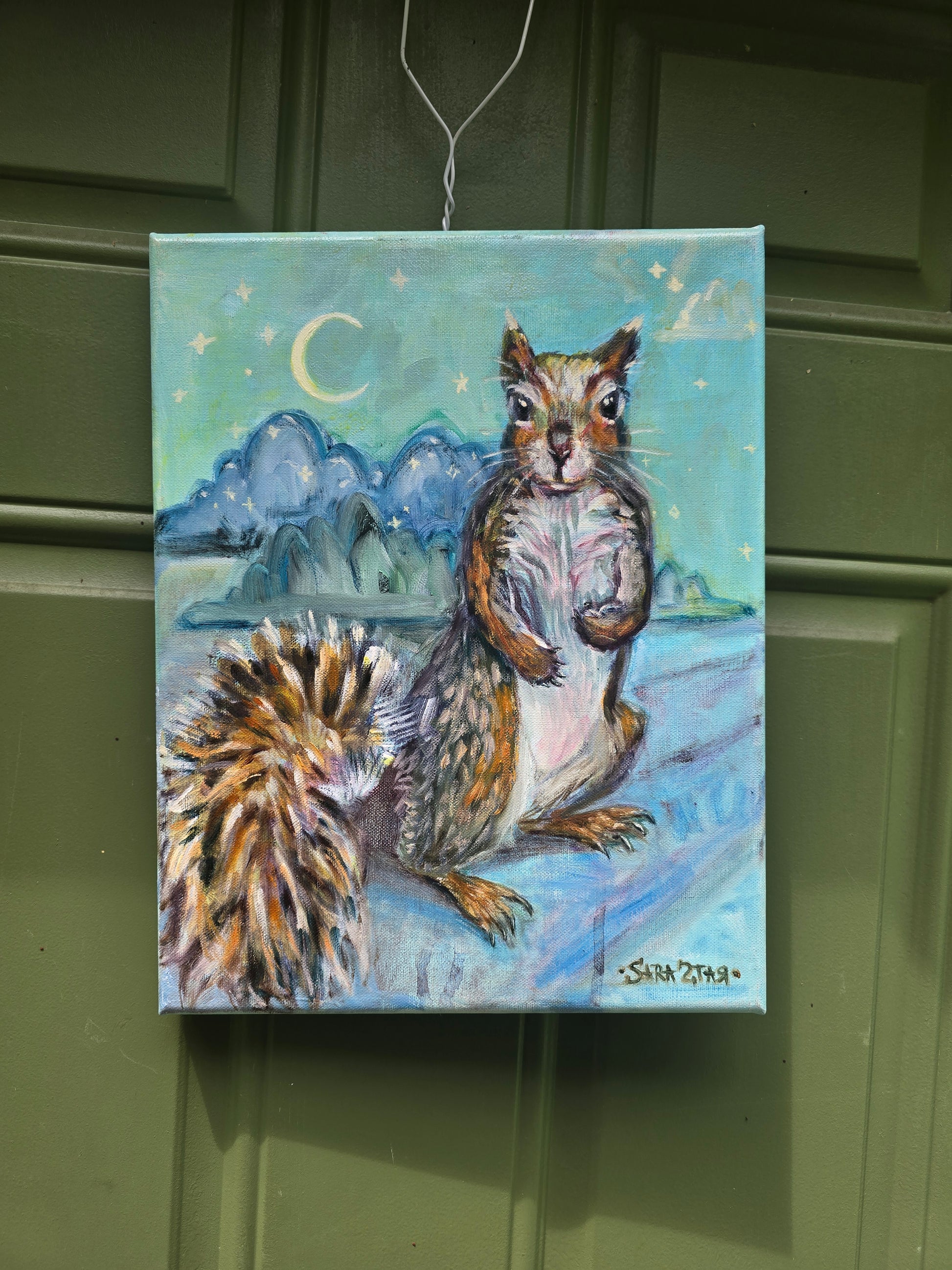 A cute squirrel on a light blue night sky background